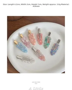 Detail shot of wavy acetate hair clips in macaron colors showing 6.2cm size and texture