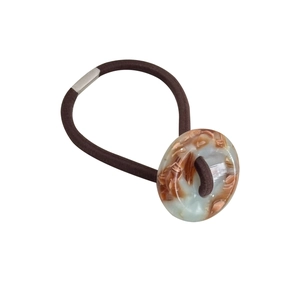 Minimalist high elastic hair tie with amber marble resin piece on white background