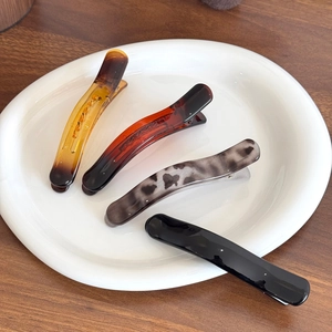 Set of 4 jelly texture duckbill hair clips in amber and tortoiseshell patterns