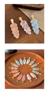 Close-up of marble acetate hair clips with wavy edges on a natural wooden display