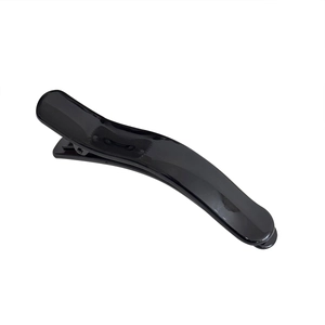 Glossy black duckbill hair clip for styling and volume on a clean white background