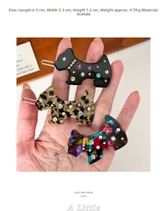 Close-up of lightweight acetate puppy hair clips with rhinestones in three colors