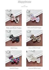 Detailed close-up of acetate Scottish Terrier hair clips with sparkling rhinestones