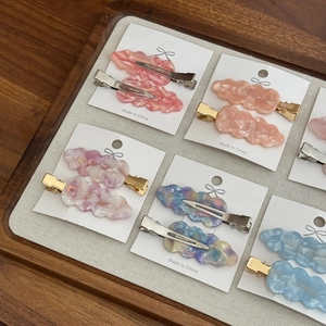 Elegant wave-shaped acetate hair clips set for women in various pastel colors