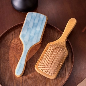 Premium wood air cushion paddle hairbrush with blue acetate marble finish on wooden tray