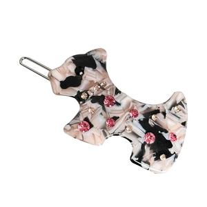 Elegant dog-shaped acetate hair clip with sparkling rhinestones in marble textures