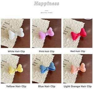 Lot de six barrettes nœuds en résine pailletée aux couleurs acidulées et finition brillante