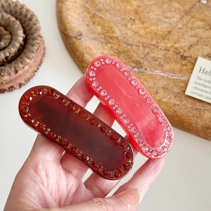 Elegante fermaglio per capelli in acetato colorato con strass in bordeaux e rosa