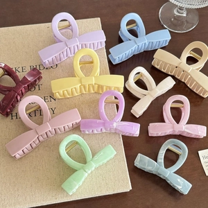 Set of 10 candy-colored bow hair claws in macabre and marble patterns for women