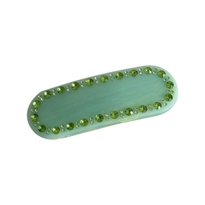 Elegante fermaglio in acetato verde con cristalli di strass e trama marmorizzata da donna