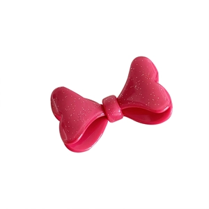 Barrette à cheveux nœud rose scintillant avec une finition en résine brillante