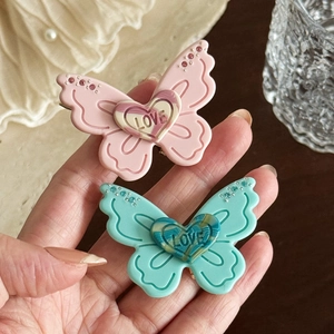3D acetate butterfly hair clips in pink and green with Love heart detail for women