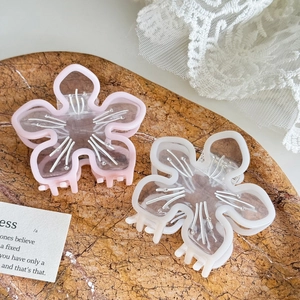 Pinces à cheveux fleurs de cerisier roses et blanches avec cristaux sur pierre