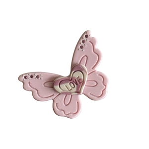 Pink acetate butterfly hair clip with heart love engraving and sparkling rhinestones
