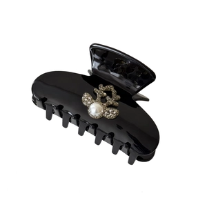 Elegant black acetate hair claw clip with pearl and rhinestone reindeer motif ornament