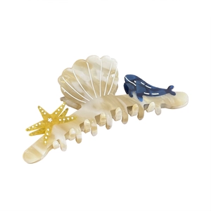 Ocean-themed marble acetate shark hair claw with starfish, shell, and whale motifs