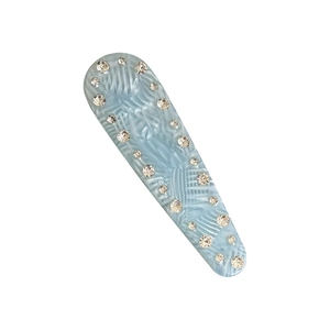 Light blue acetate hair clip with marble texture and rhinestones on a white background