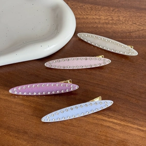 Élégant lot de quatre barrettes à cheveux en acétate et strass de tons pastel