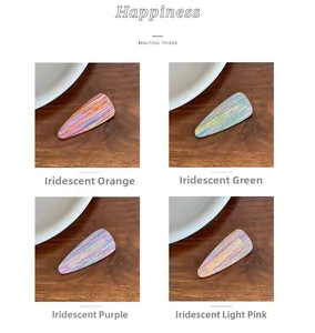 Detailed view of four colorful iridescent acetate teardrop hair clips in a grid layout