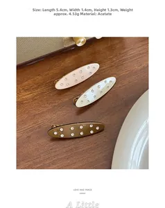 Detail view of 5.4cm oval acetate hair clips with inlaid rhinestones and 3-piece set dimensions