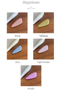 Detail of five teardrop hair clips with fine glitter finish in assorted candy colors