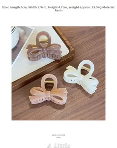 Close-up of three jelly-colored resin bow hair clips in coffee, cream, and pink colors