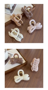 Close-up of elegant jelly-colored bow hair clips in coffee and cream matte finishes