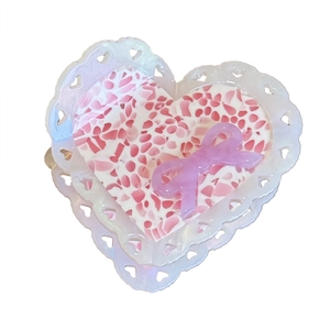 Elegant acetate heart hair claw clip with pink stone pattern and purple bow accent