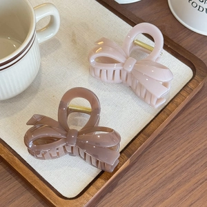 Elegant jelly-colored 3D bow hair claw clips in soft pink and morandi purple finish