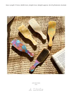 Detail view of five acetate hair combs with marble textures on a woven mat