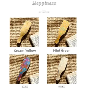 Detail of four acetate hair combs showing translucent marble patterns and vibrant colors