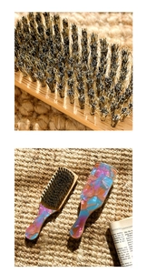 Macro shot of boar bristles and wooden handle with iridescent resin inlay detail