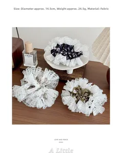 Detailed macro view of three lace floral hair scrunchies on a white porcelain dish