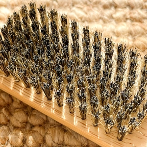 Premium anti-static wood hairbrush with high-density bristles on a woven sisal mat
