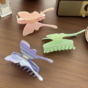 Oversized acetate butterfly hair claws in pink, mint green and gradient blue marble colors