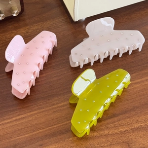 Set of large acetate shark hair clips with rhinestones in pink, beige, and green colors