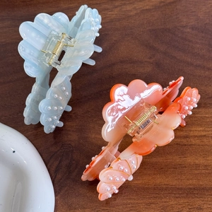 Dreamy pearlescent shell hair claws in blue and coral with pearl accents for women