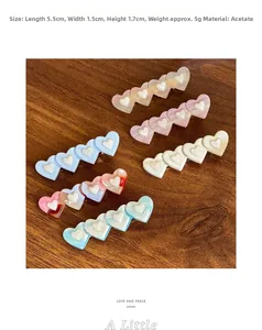 Détail des pinces à cheveux coeur en acétate montrant la taille 5,5cm et la texture