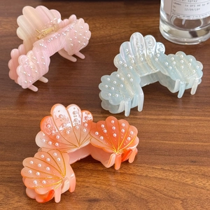 Elegant pearl-studded acetate shell hair claws in soft pastel colors for women