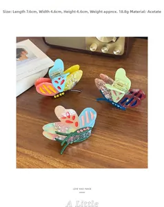 Detailed view of acetate butterfly hair claw with rhinestones and 7.6cm dimensions