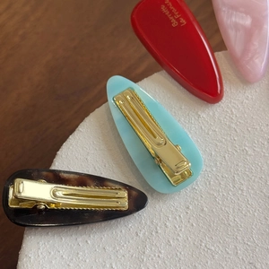 Minimalist 4mm acetate hair clips in red, pink, blue, and tortoiseshell with gold duckbill