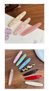 Detailed set of premium oval acetate hair clips in assorted marble and tortoise patterns