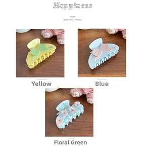Set dettagliato di mollette in acetato giallo, blu e verde floreale con accenti floreali