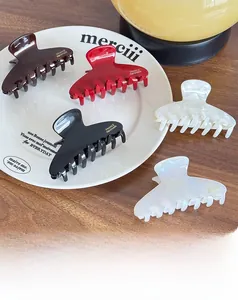 Set of five elegant acetate hair claws with gold logo in assorted vintage colors