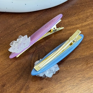 Elegant 3D camellia hair clips set in purple and blue acetate with gold duckbill pins