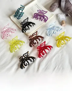 Detailed collection of colorful acetate butterfly hair claws on a cozy white backdrop