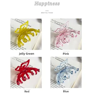 Detailed set of four translucent butterfly hair claws in jelly green pink red and blue