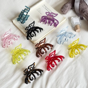 Jelly color acetate butterfly hair claws set in nine assorted colors on white fabric