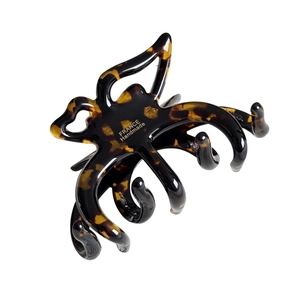 Elegant tortoiseshell claw clip with gold France Handmade label on white backdrop
