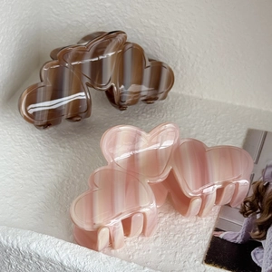 Elegant heart-shaped acetate hair claw clips with marble texture for stylish ponytails